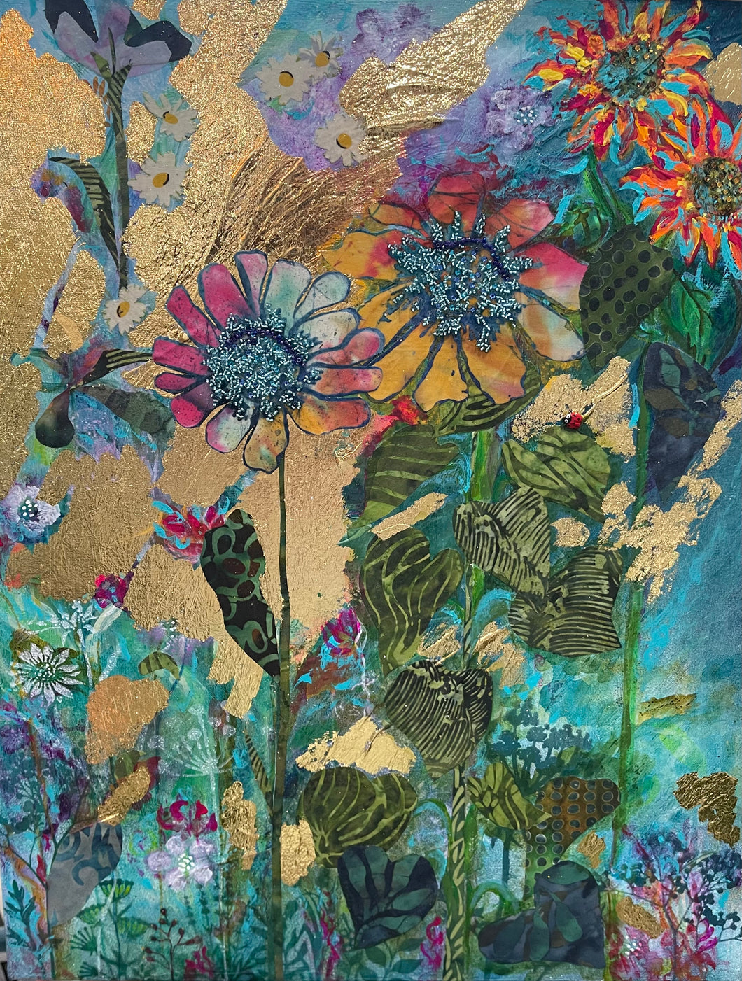 Colorful floral artwork made with layered fabric and mixed media, featuring sunflower blooms in golden yellow and ochre tones with textured layered details
