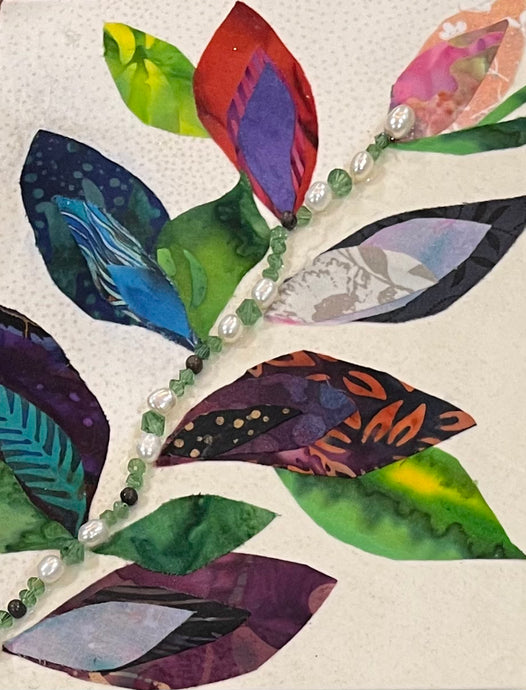 Botanical artwork made with layered fabric and mixed media, featuring flowing forms in soft green and neutral tones with layered textured details