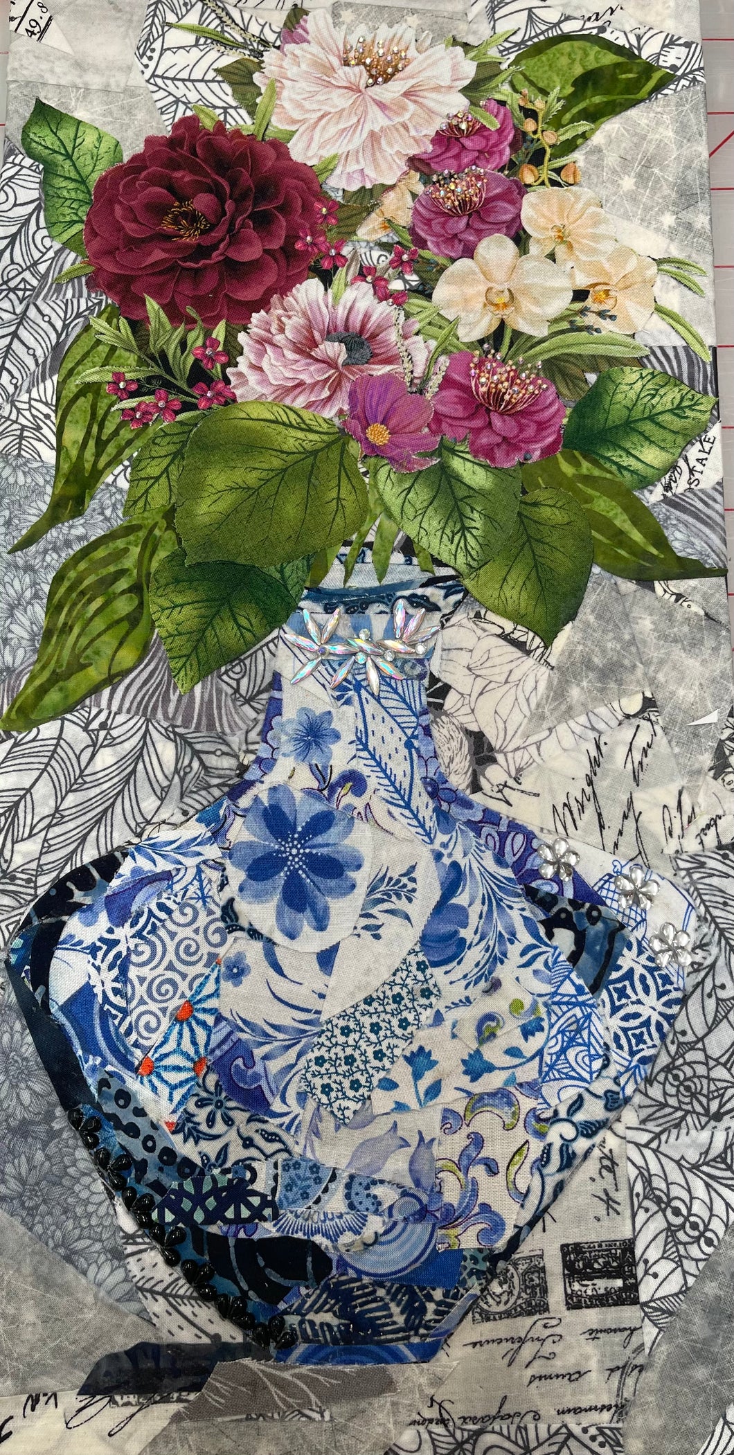 Decorative  layered collage with floral arrangement and blue Chinioserie patterned vase on textured background