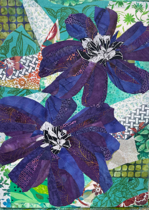 Large purple blue flowers on a multicolored  patchwork background made with layered fabric and mixed media, featuring blended hues of greens and teals