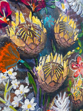 Close detail of textured acrylic surface on original botanical painting Where the Garden Overflows by Robyn Moore Arts, showing dimensional texture medium building protea and artichoke bloom forms in warm gold and yellow against deep moody blue green background