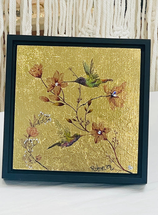 Original hummingbird mixed media artwork 6x6 inches, two watercolor image transfer hummingbirds visiting amber blossoms with Swarovski crystal centers, solid gold leaf background, birch panel, Golden Hour Collection, Robyn Moore Arts