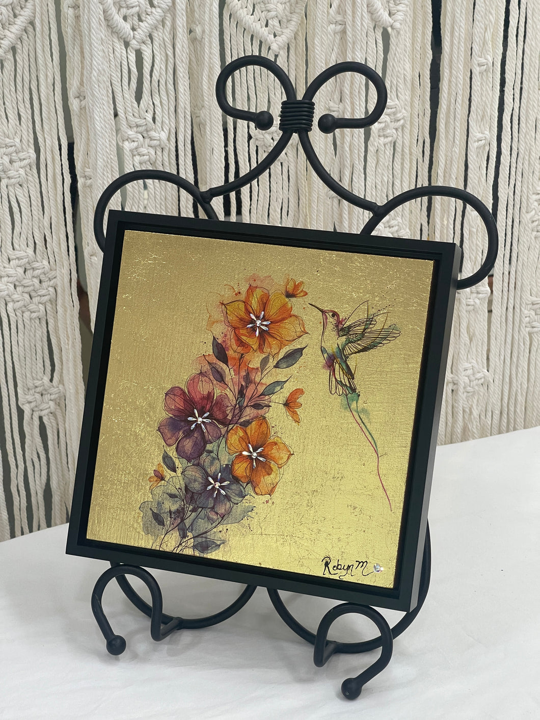 Original hummingbird mixed media artwork 8x8 inches, fine line hummingbird in watercolor wash over rust, gold, and plum blossoms with Swarovski crystal centers, gold leaf ground, birch panel, Golden Hour Collection, Robyn Moore Arts