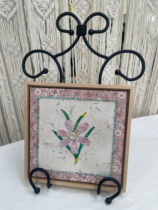 Original pink flower fabric artwork 8x8 inches, single pink bloom with green leaves, Czech glass bead border, Swarovski crystals in the center and floral fabric border, light maple floating frame, Inherited Blooms Collection, Robyn Moore Arts