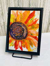 Sunflower wall art in fabric mixed media with layered petals, warm tones, and dimensional textile detail
