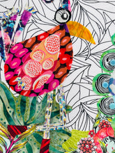 Close detail of Swarovski crystal embellished legs and Czech glass bead tail feathers on original whimsical bird artwork A Shared Journey by Robyn Moore Arts, showing jewel like crystal work catching light against patterned batik fabric