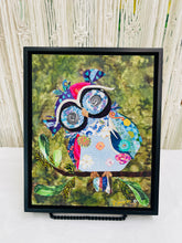 Original whimsical owl fabric artwork 8x10 inches, patchwork owl in blue lavender teal magenta coral fabric with Czech glass bead eye rings spiral center eyes Swarovski crystal flower details purple fabric crown Czech glass bead leaf branch, deep olive brown batik background, birch panel, Whimsical Companions Collection, Robyn Moore Arts