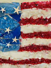 Close-up of red, wite and blue flag showing starfish in the blue as stars