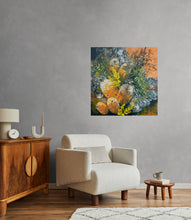 Living room with a beige armchair, wooden sideboard, and organic banksia blooms and greenery on the wall.