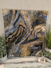 abstract resin art in black brown bronze and white to look like a agate