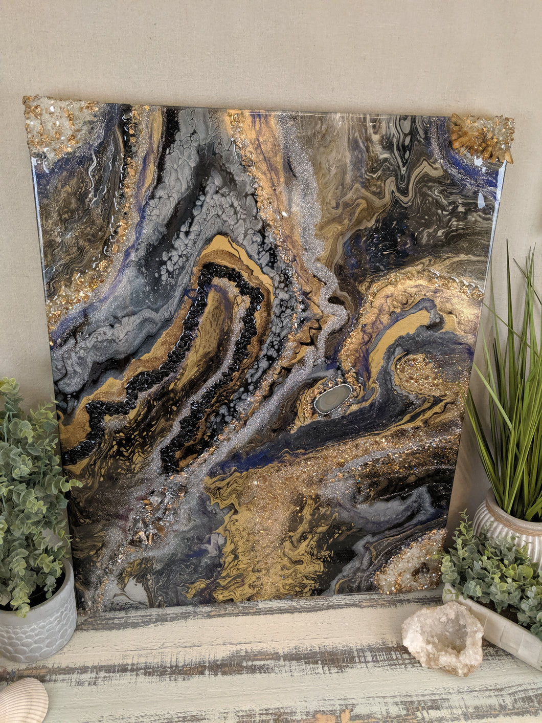 abstract resin art in black brown bronze and white to look like a agate
