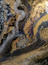 abstract resin art in black brown bronze and white to look like a agate close up