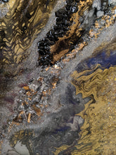 abstract resin art in black brown bronze and white to look like a agate close up