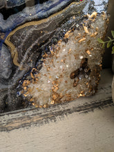 abstract resin art in black brown bronze and white to look like a agate close up