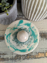 green and white polka dot candle canister with teal white sphere lid