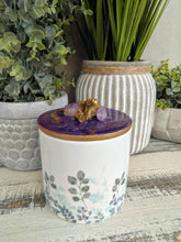 Designer candle canister with purple and gold crystals lid