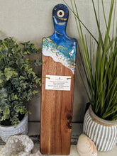 abstract ocean resin cheese board with shells and fire glass