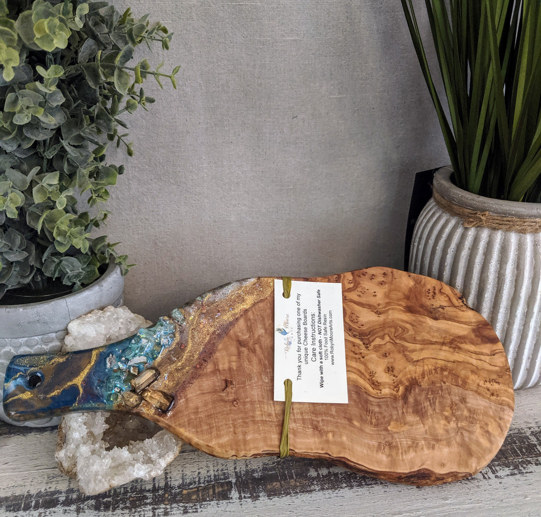 abstract teal and gold cheeseboard with crystals