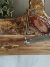 close up wood marble pumpkin cheeseboard with gold copper bronze resin art