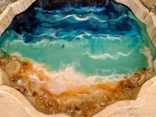 close up shell ocean tray in blue and teal