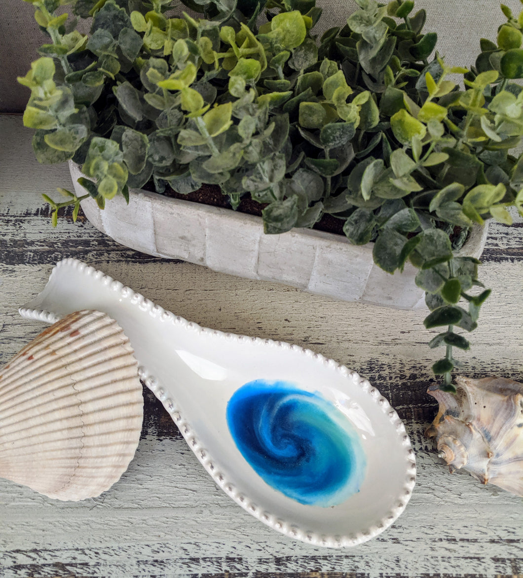 white ceramic spoon rest with ocean inspired resin