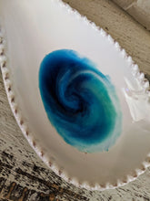 white ceramic spoon rest with ocean inspired resin