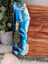 wood cheese board with ocean scene and handles