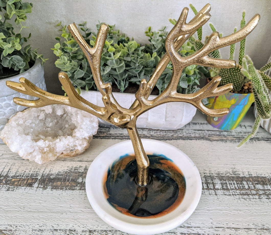 ceramic round dish with gold branches and teal and bronze resin