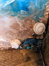 close up ocean looking wood tray resin blue teal white shells