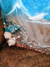 close up ocean looking wood tray resin blue teal white shells