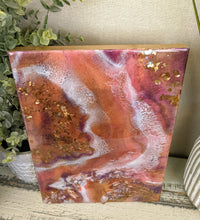 vibrant abstract resin art in orange white purple with crystals