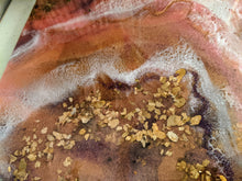 close up vibrant abstract resin art in orange white purple