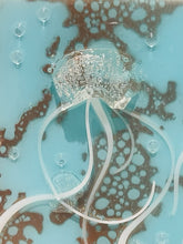 close-up of jelly fish showing body and white tentacles