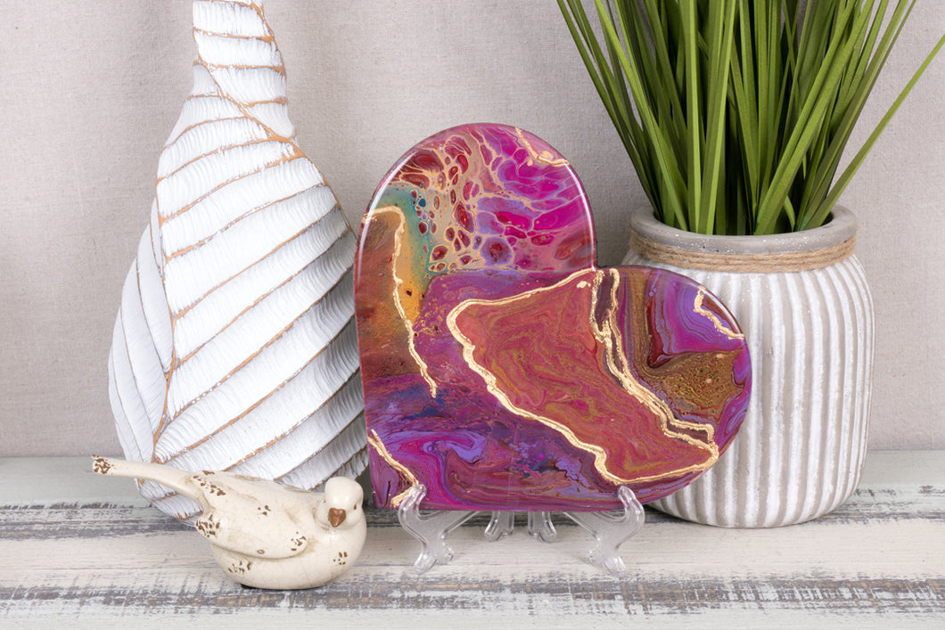 Abstract red pink gold teal resin heart.