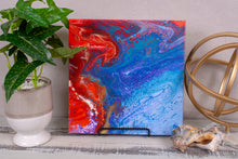 abstract fluid acrylic painting with texture and vibrant rainbow colors