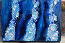 underwater blue ocean art with glass bubbles close up