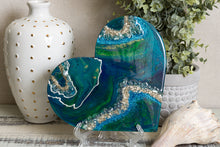 abstract blue green heart with stones
