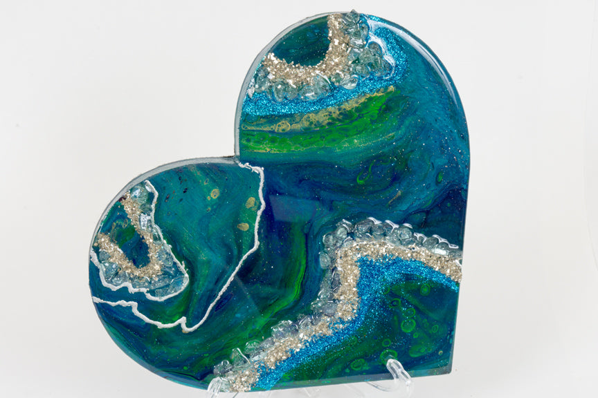 abstract blue green heart with stones