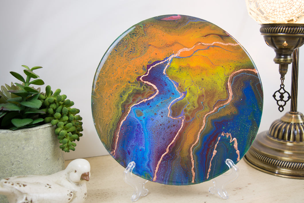 organic swirls of blue, purple, green and orange accented with copper foil 