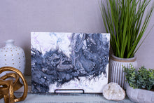 abstract fluid acrylic painting with texture and black and silver colors